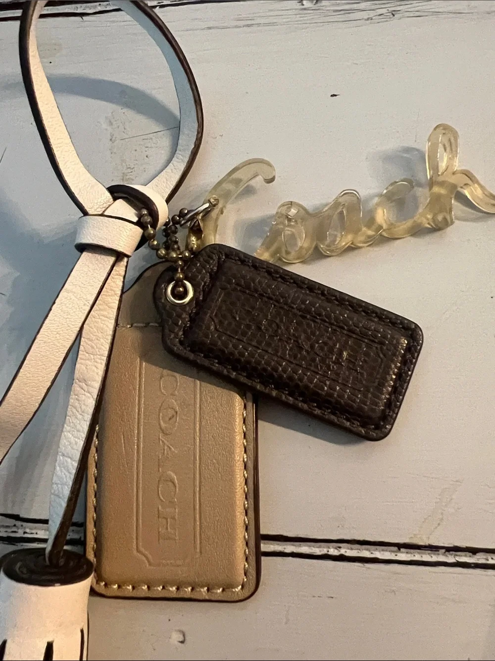 Coach White Tassel Keychain with Gold Script Charm